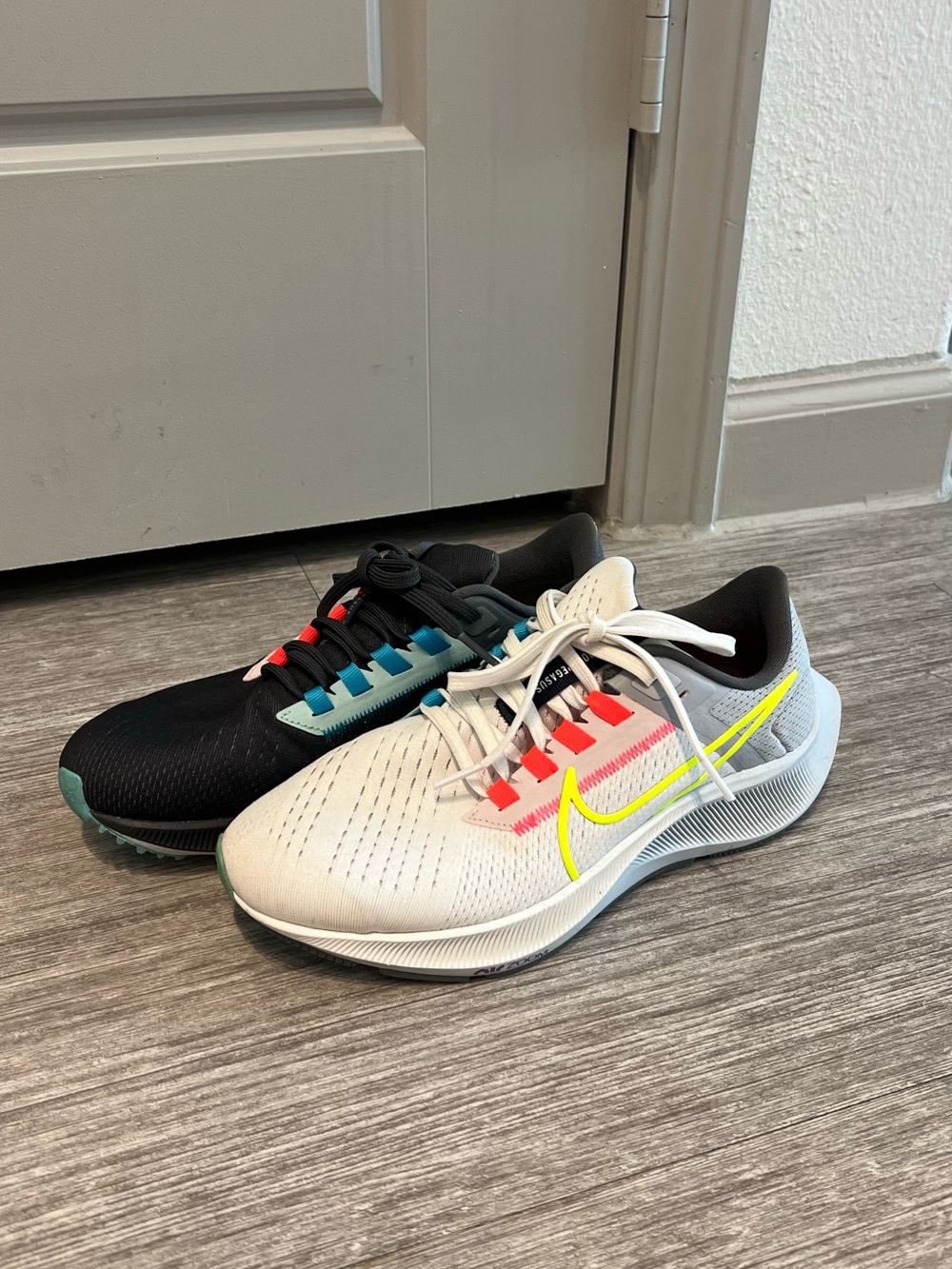 Nike Women Two-Tone Running Sneakers – White & Black with Neon Swoosh